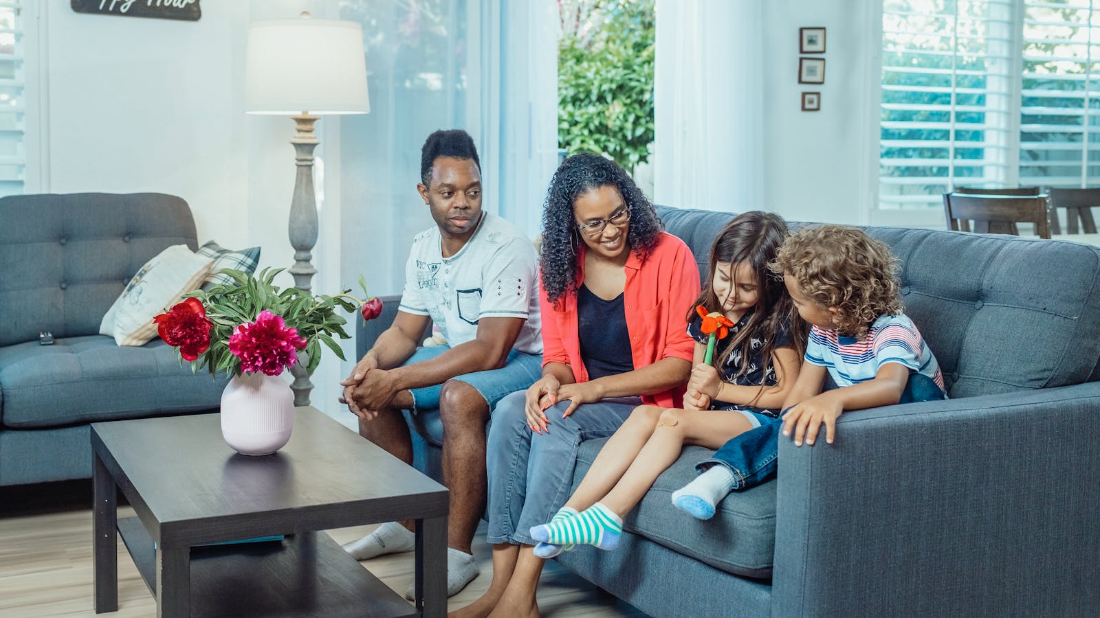 Parents relaxing and bonding with their children at home